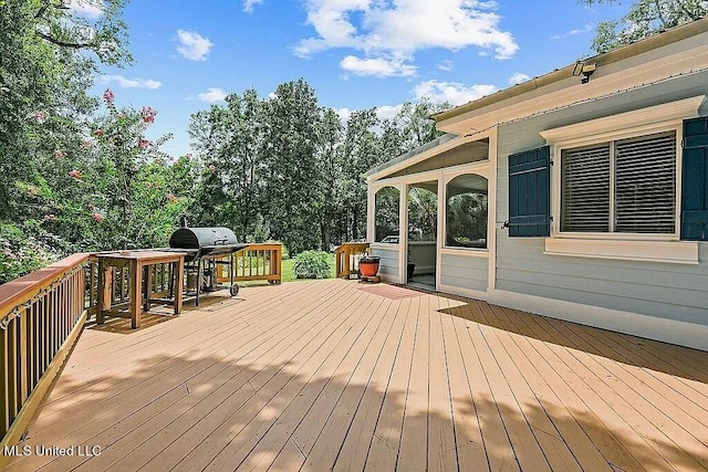 wooden terrace with area for grilling