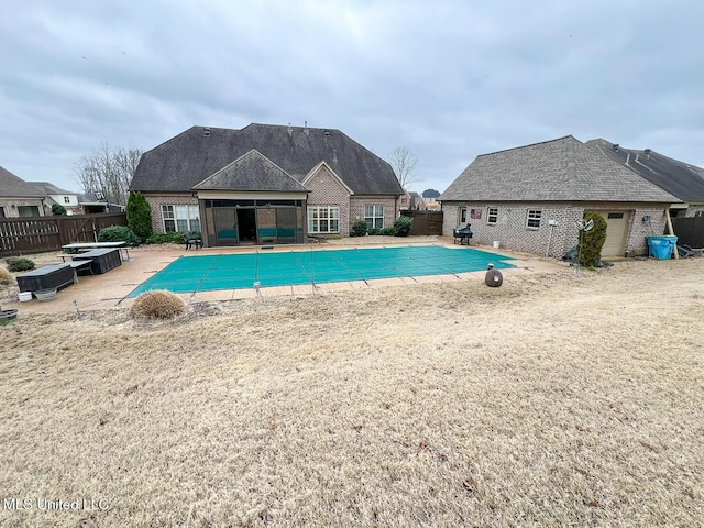 view of pool featuring a patio area and a diving board