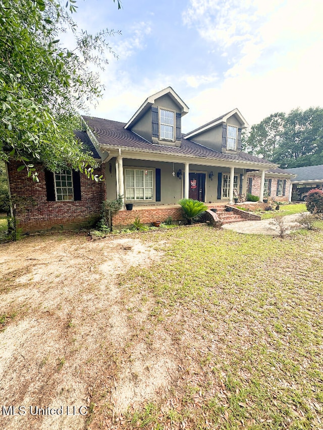 2011 Riverwood Dr, Vancleave, MS 39565 - view of front of house featuring brick siding, covered porch, and a front lawn