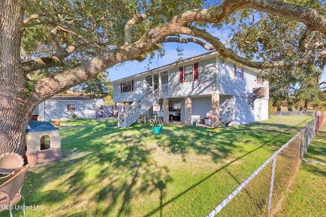 back of property featuring a lawn