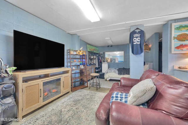 living room with concrete flooring