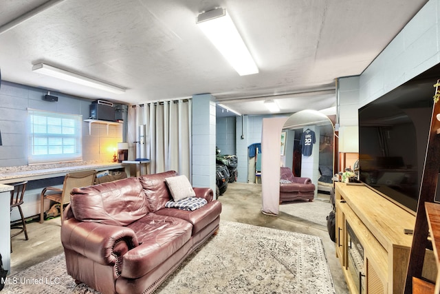 living room featuring concrete flooring