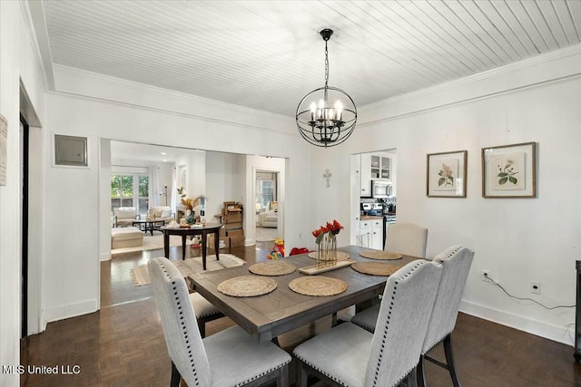 dining area featuring wooden ceiling, ornamental molding, and an inviting chandelier