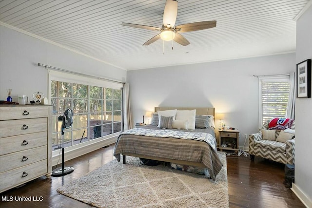 bedroom with multiple windows, ceiling fan, and dark hardwood / wood-style floors