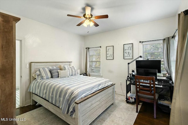 bedroom with ceiling fan and light wood-type flooring