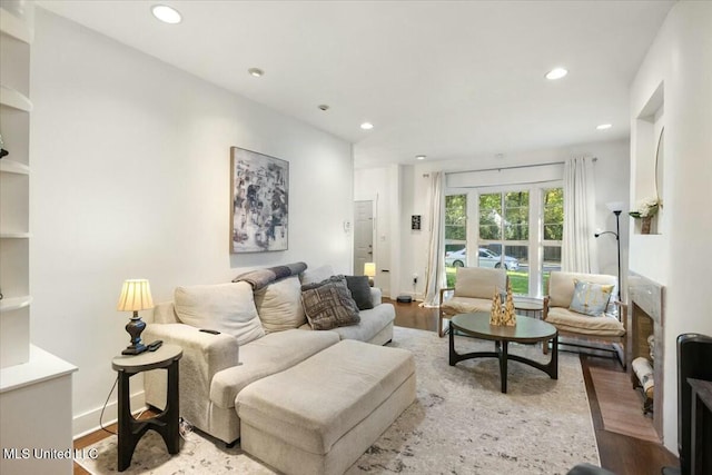 living room with light hardwood / wood-style flooring