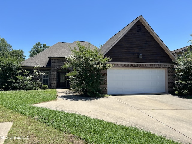 519 Morning Glory Cv, Madison, MS 39110 - view of front facade with brick siding and concrete driveway