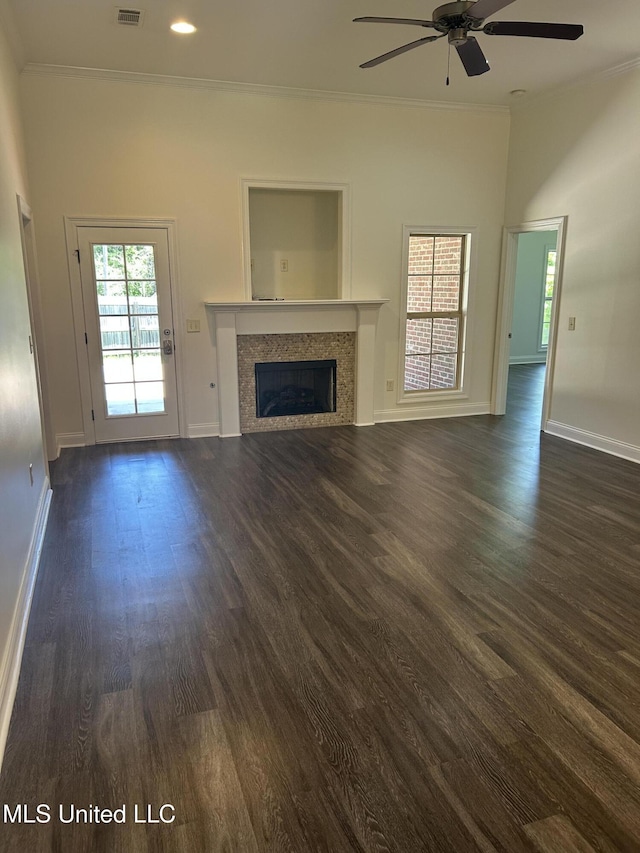 519 Morning Glory Cv, Madison, MS 39110 - unfurnished living room featuring crown molding, ceiling fan, baseboards, a fireplace, and dark wood-style flooring