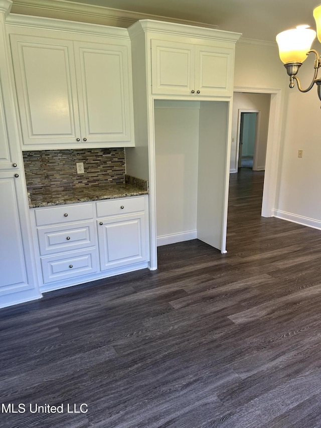 519 Morning Glory Cv, Madison, MS 39110 - kitchen featuring a chandelier, decorative backsplash, white cabinetry, baseboards, and crown molding