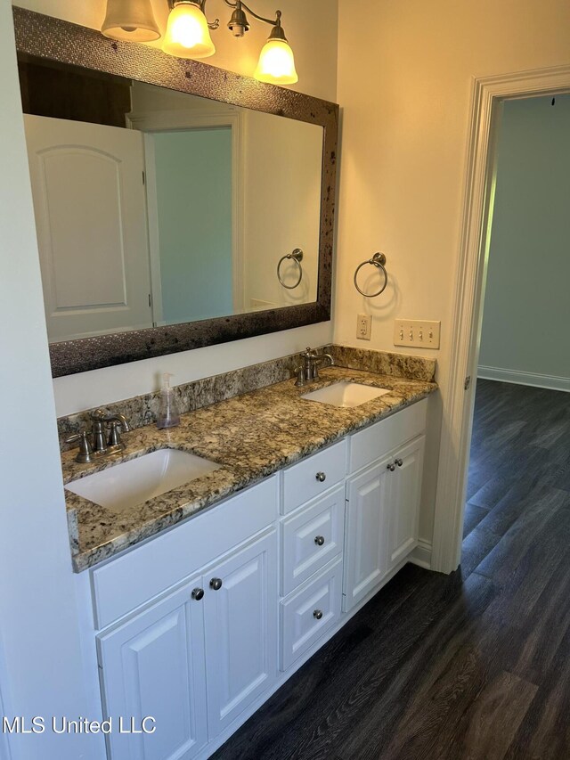519 Morning Glory Cv, Madison, MS 39110 - full bathroom with double vanity, wood finished floors, and baseboards