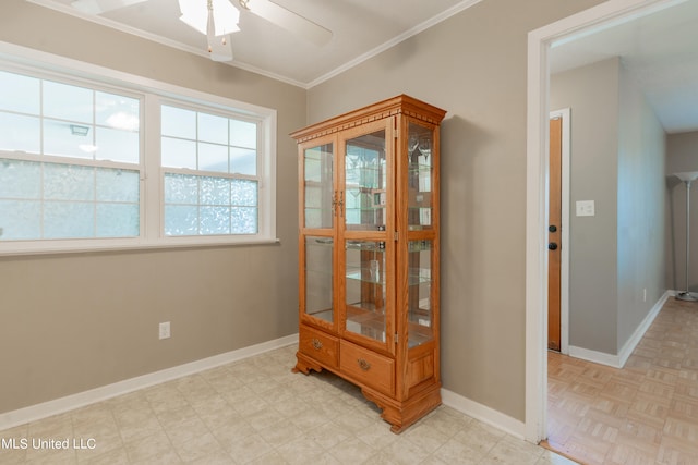 corridor with crown molding and light parquet flooring