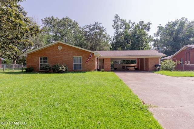 ranch-style home featuring a front lawn and a carport