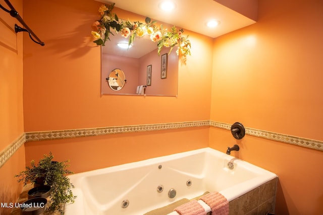 bathroom featuring tiled bath