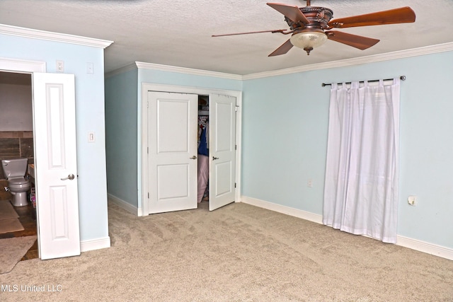 unfurnished bedroom with a textured ceiling, ceiling fan, crown molding, and light carpet