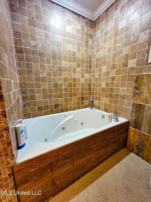 bathroom with a bath and ornamental molding