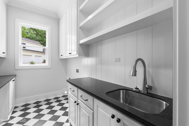 231 Oakside Trl, Madison, MS 39110 - kitchen featuring dark floors, a sink, dark countertops, and white cabinets
