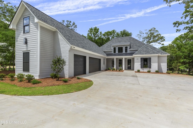 231 Oakside Trl, Madison, MS 39110 - view of front of property with an attached garage, driveway, and roof with shingles