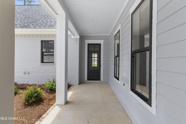 231 Oakside Trl, Madison, MS 39110 - doorway to property with a shingled roof and brick siding