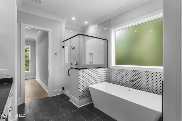 231 Oakside Trl, Madison, MS 39110 - bathroom with a freestanding bath, a stall shower, crown molding, vanity, and recessed lighting