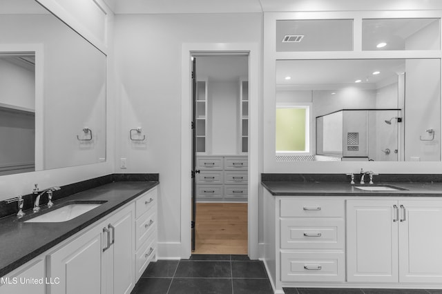 231 Oakside Trl, Madison, MS 39110 - full bathroom with a shower stall, tile patterned flooring, and two vanities