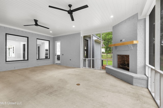 231 Oakside Trl, Madison, MS 39110 - unfurnished living room featuring ceiling fan, concrete flooring, an outdoor brick fireplace, ornamental molding, and wood ceiling