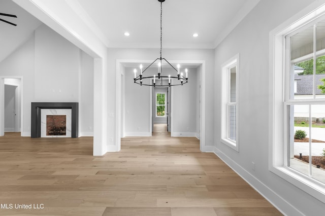 231 Oakside Trl, Madison, MS 39110 - unfurnished dining area featuring a chandelier, plenty of natural light, baseboards, a fireplace, and recessed lighting