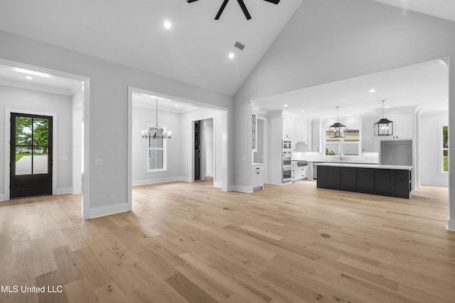 231 Oakside Trl, Madison, MS 39110 - unfurnished living room featuring a chandelier, recessed lighting, light wood finished floors, a ceiling fan, and baseboards