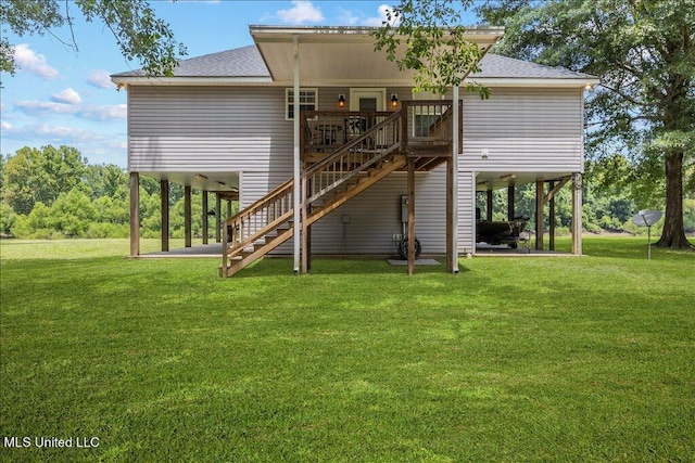 back of property with a patio area, a deck, and a lawn