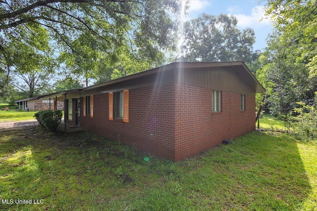 308 Asbury Dr, Hazlehurst, MS 39083 - view of side of property featuring a yard and brick siding