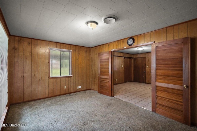 308 Asbury Dr, Hazlehurst, MS 39083 - unfurnished bedroom with carpet flooring and wooden walls