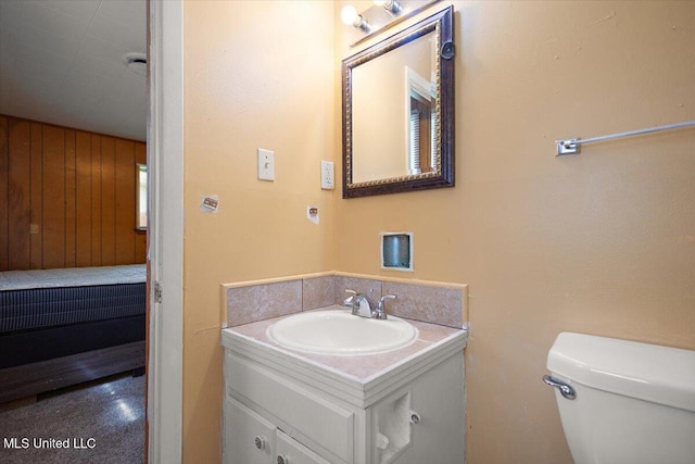 308 Asbury Dr, Hazlehurst, MS 39083 - half bath featuring vanity and wooden walls