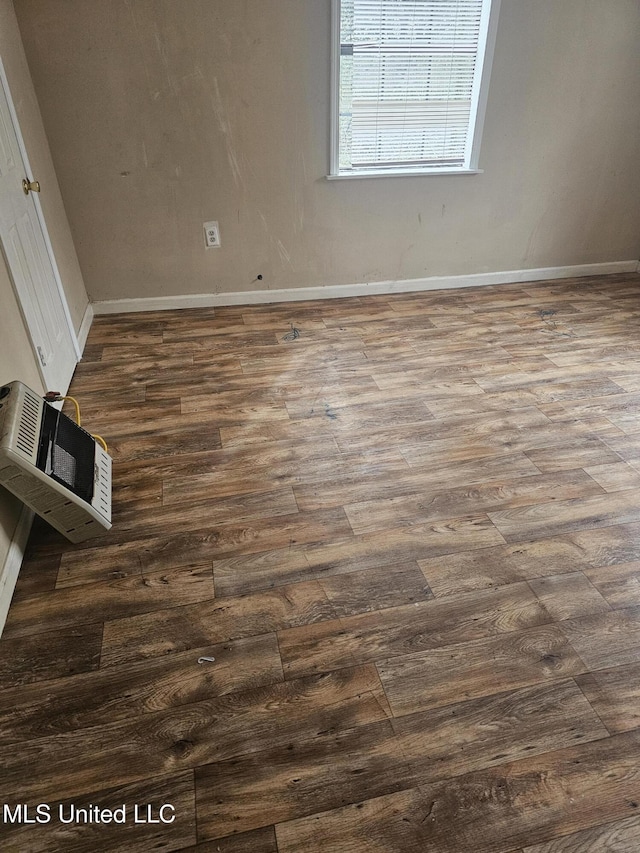 219 W St, Batesville, MS 38606 - interior space with dark wood finished floors and baseboards