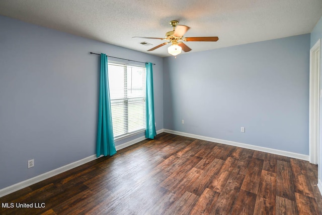 796 Steward Ln, Southaven, MS 38671 - spare room with ceiling fan, dark wood-type flooring, baseboards, and a textured ceiling