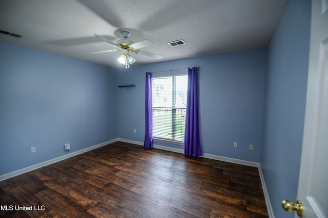 796 Steward Ln, Southaven, MS 38671 - spare room with dark wood-type flooring, baseboards, a ceiling fan, and a textured ceiling