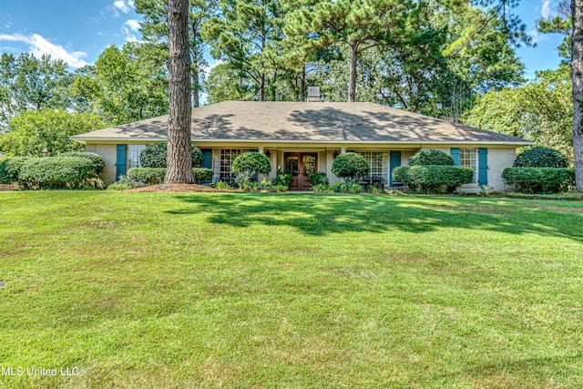 ranch-style home with a front yard