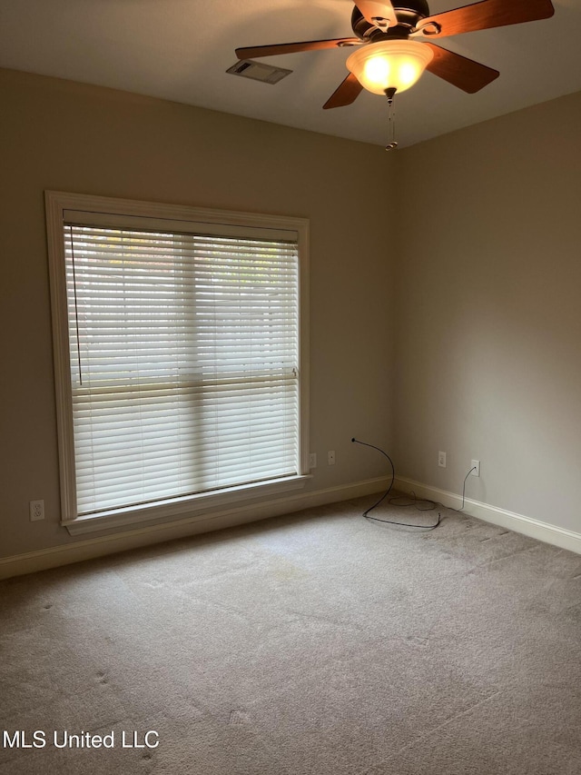 carpeted empty room with ceiling fan