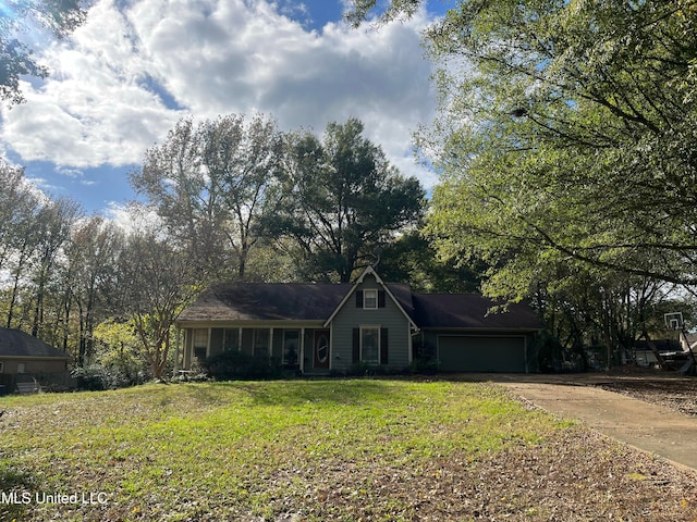 single story home with a front yard and a garage