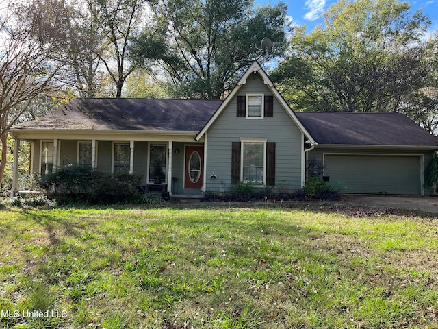 view of front of property with a garage and a front lawn