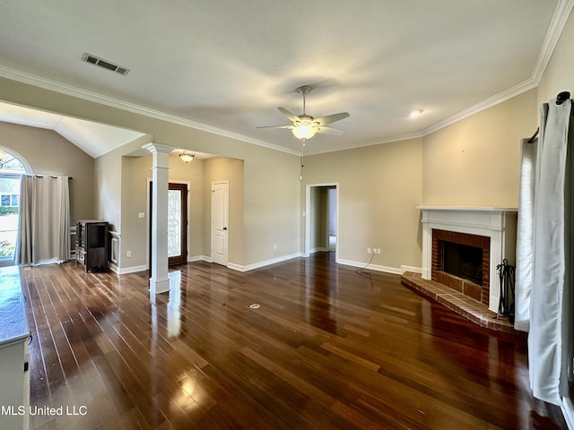 unfurnished living room featuring wood finished floors, ornate columns, a fireplace, visible vents, and ceiling fan