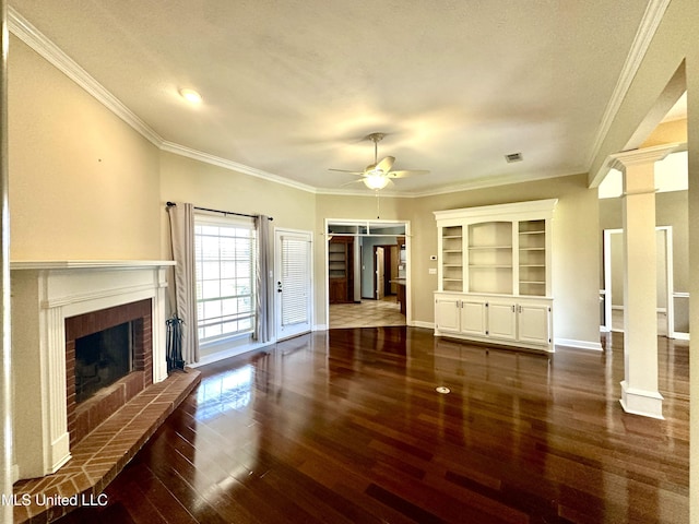 unfurnished living room featuring baseboards, ornamental molding, ceiling fan, a brick fireplace, and dark wood-style floors