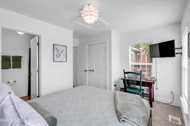 2207 Government St Unit 15, Ocean Springs, MS 39564 - bedroom with attic access, a closet, and baseboards