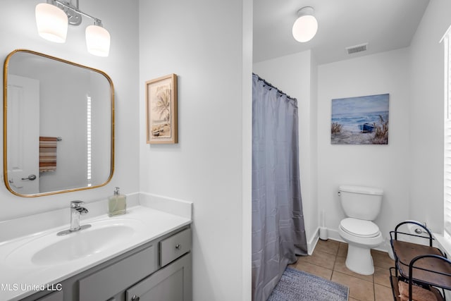 2207 Government St Unit 15, Ocean Springs, MS 39564 - full bath with vanity, tile patterned floors, toilet, and a shower with shower curtain