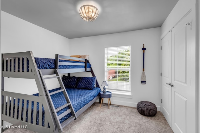 2207 Government St Unit 15, Ocean Springs, MS 39564 - carpeted bedroom featuring baseboards and a chandelier