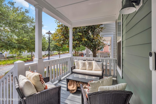 2207 Government St Unit 15, Ocean Springs, MS 39564 - covered porch featuring an outdoor hangout area