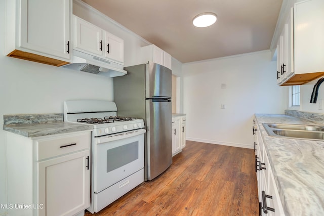 kitchen featuring white range with gas cooktop, white cabinetry, sink, and hardwood / wood-style floors