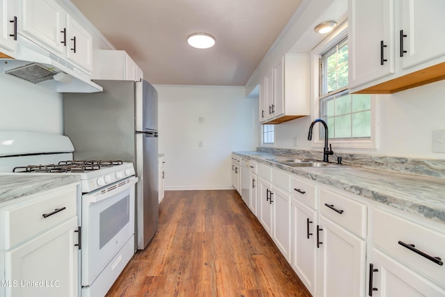258 Porter Ave, Biloxi, MS 39530 - kitchen with white cabinets, white range with gas stovetop, a sink, and dark wood-style floors