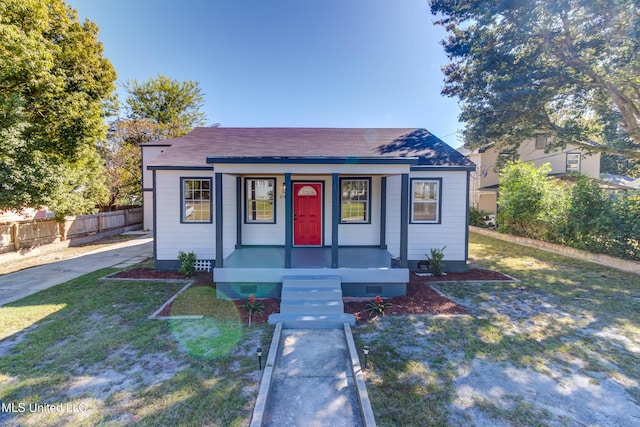258 Porter Ave, Biloxi, MS 39530 - bungalow with crawl space, a shingled roof, covered porch, fence, and a front yard