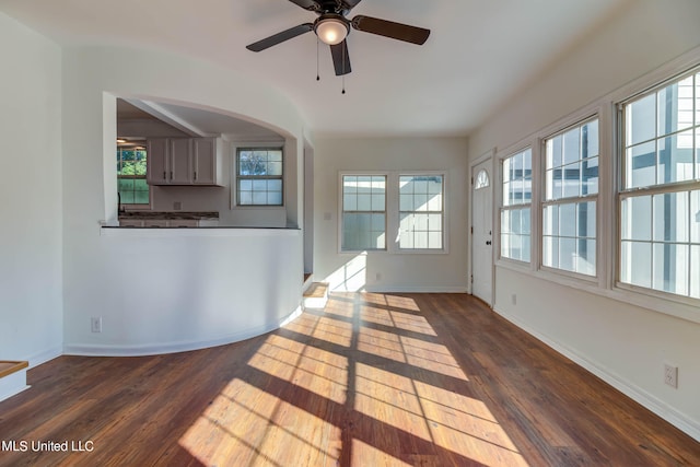 interior space with wood-type flooring and ceiling fan