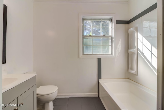 258 Porter Ave, Biloxi, MS 39530 - full bath with tile patterned floors, toilet, baseboards, a tub to relax in, and vanity