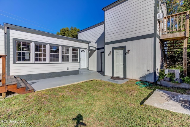 258 Porter Ave, Biloxi, MS 39530 - back of house with a lawn, a wooden deck, and a patio